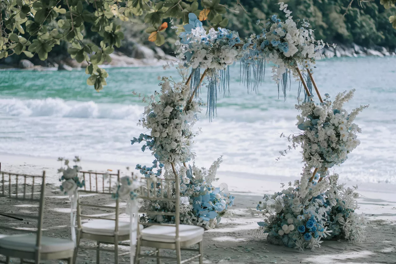 floral wedding arch on the beach